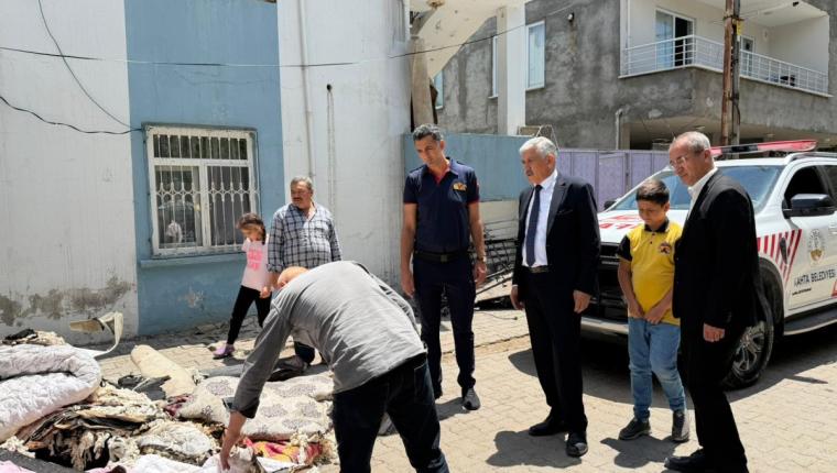 Başkan Hallaç yangın mağduru aileyi yalnız bırakmadı
